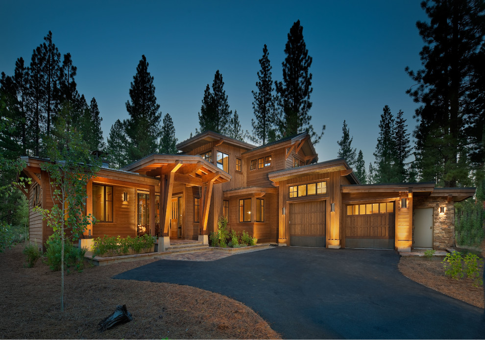 Design ideas for a country two-storey exterior in Sacramento with wood siding.