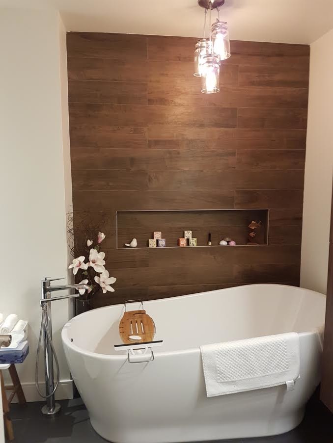 Inspiration for a mid-sized transitional master brown tile and porcelain tile slate floor and gray floor freestanding bathtub remodel in Orange County with white walls, open cabinets and dark wood cabinets