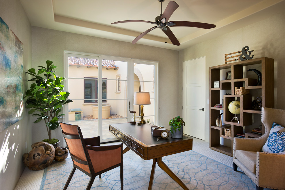 Mid-sized transitional home office in Orange County with brown walls, carpet, a freestanding desk and beige floor.