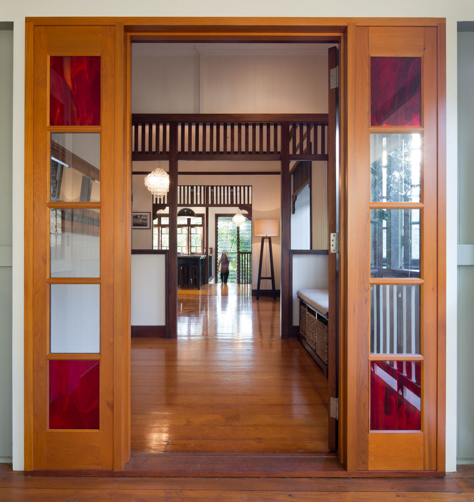 Inspiration for a mid-sized transitional front door in Brisbane with white walls, light hardwood floors, a single front door and a medium wood front door.