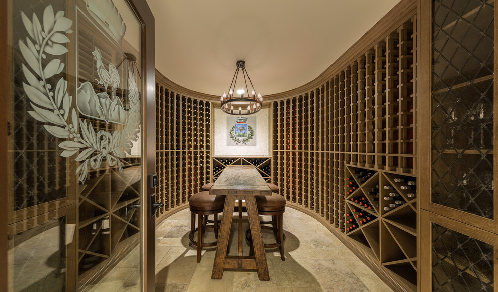 This is an example of an expansive traditional wine cellar in Tampa with ceramic floors and storage racks.