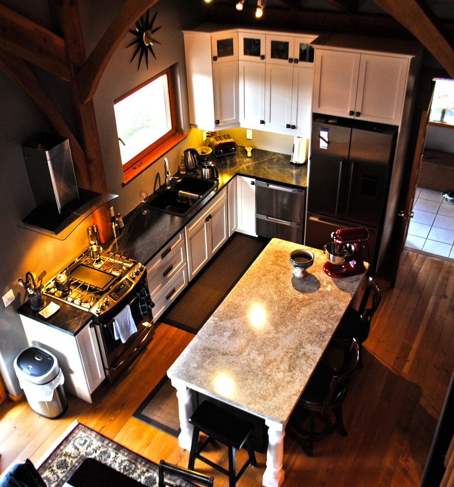 Photo of a small country l-shaped eat-in kitchen in Vancouver with shaker cabinets, white cabinets and with island.