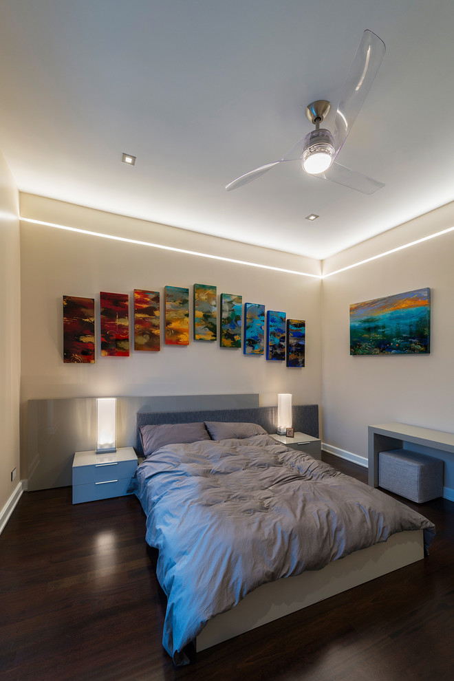 Design ideas for a contemporary bedroom in Chicago with beige walls and dark hardwood floors.