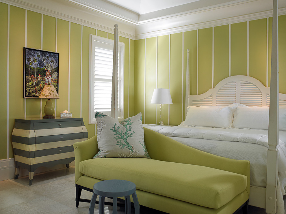 This is an example of a tropical bedroom in Toronto with green walls.