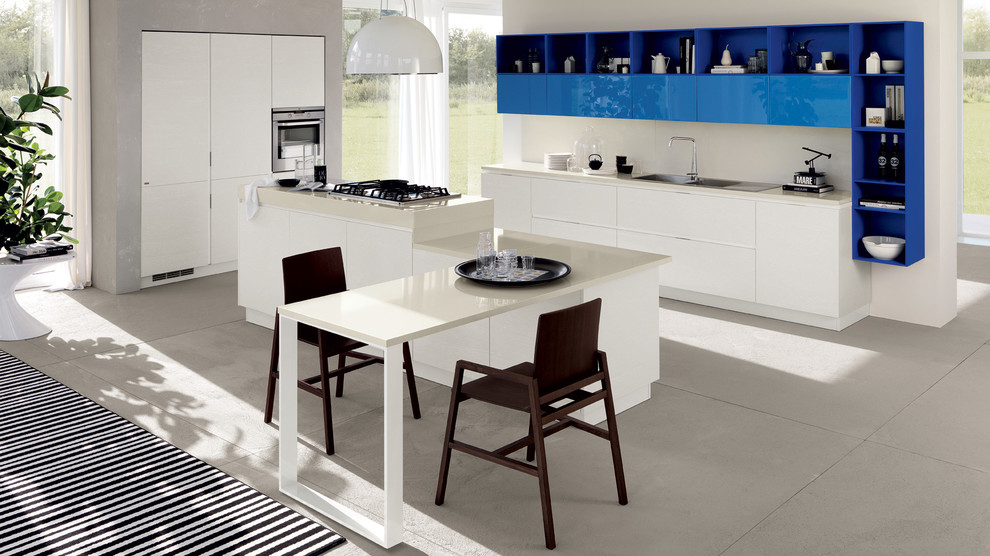 Photo of a large modern galley eat-in kitchen in Melbourne with a double-bowl sink, raised-panel cabinets, white cabinets, quartzite benchtops, beige splashback, glass sheet splashback, stainless steel appliances, porcelain floors and multiple islands.