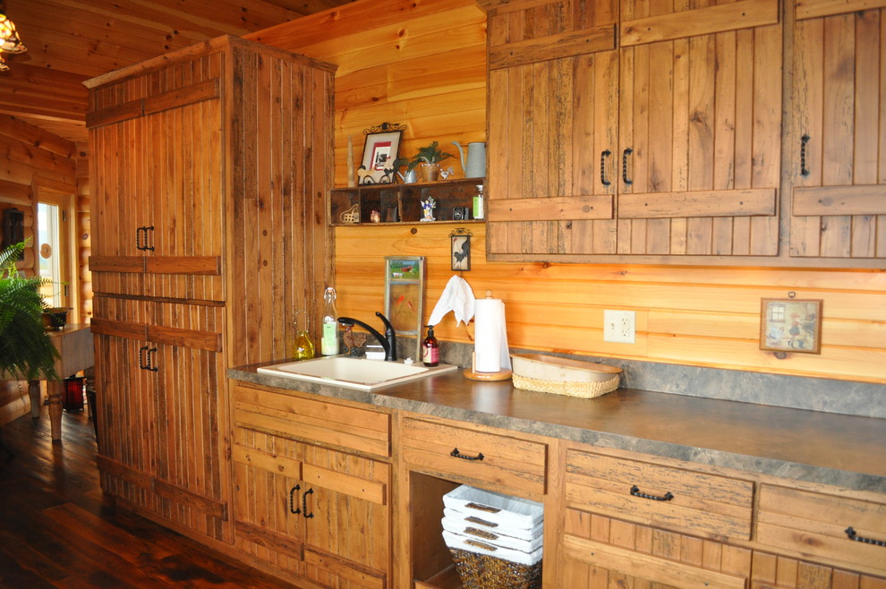 Mid-sized country l-shaped utility room in Other with medium wood cabinets, laminate benchtops, dark hardwood floors, a drop-in sink and brown walls.