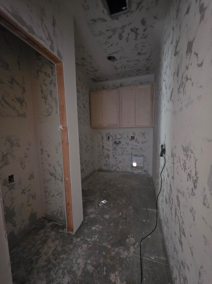 Laundry room with closet