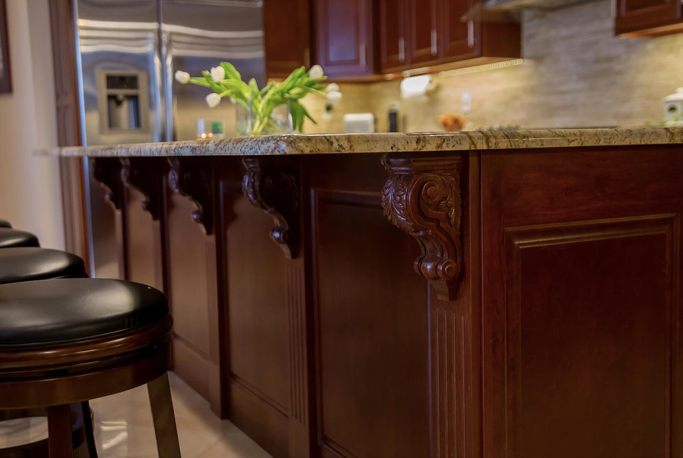 Inspiration for a large modern u-shaped porcelain tile and beige floor open concept kitchen remodel with an undermount sink, raised-panel cabinets, dark wood cabinets, granite countertops, beige backsplash, matchstick tile backsplash, stainless steel appliances, an island and multicolored countertops