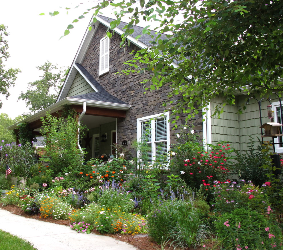 Inspiration for a traditional front yard partial sun garden in Charlotte with with flowerbed.