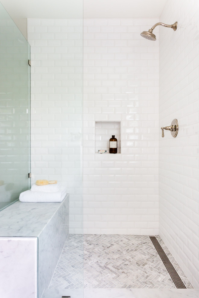 Inspiration for a transitional master bathroom in Los Angeles with grey cabinets, a freestanding tub, white tile, subway tile, marble floors, an undermount sink and marble benchtops.