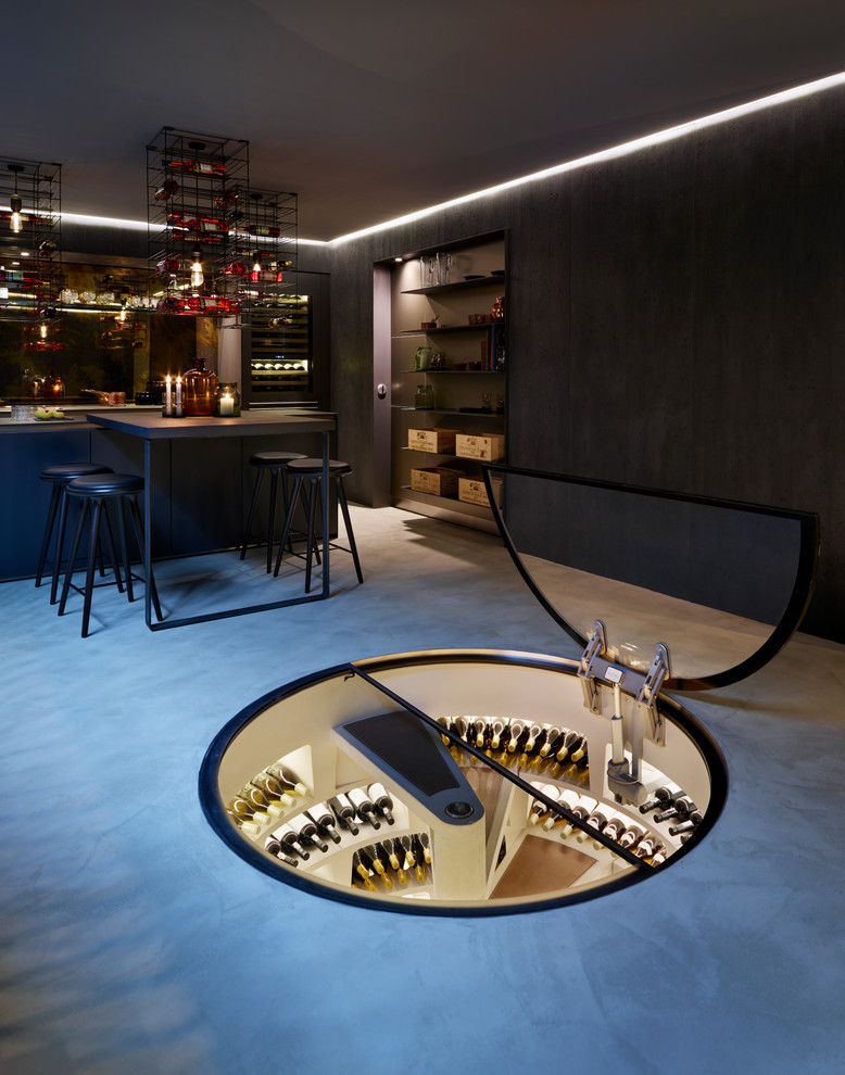 Mid-sized contemporary wine cellar in Los Angeles with concrete floors and storage racks.