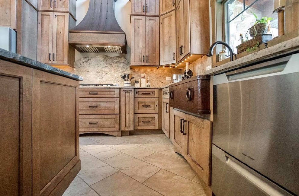 Eat-in kitchen - large rustic l-shaped beige floor eat-in kitchen idea in Chicago with a farmhouse sink, beige backsplash, stone slab backsplash, stainless steel appliances, an island and beige countertops