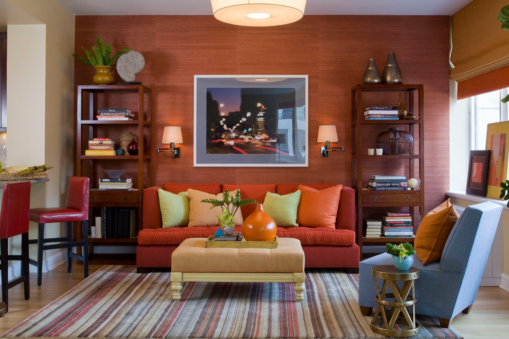 Inspiration for a contemporary family room in New York with orange walls.