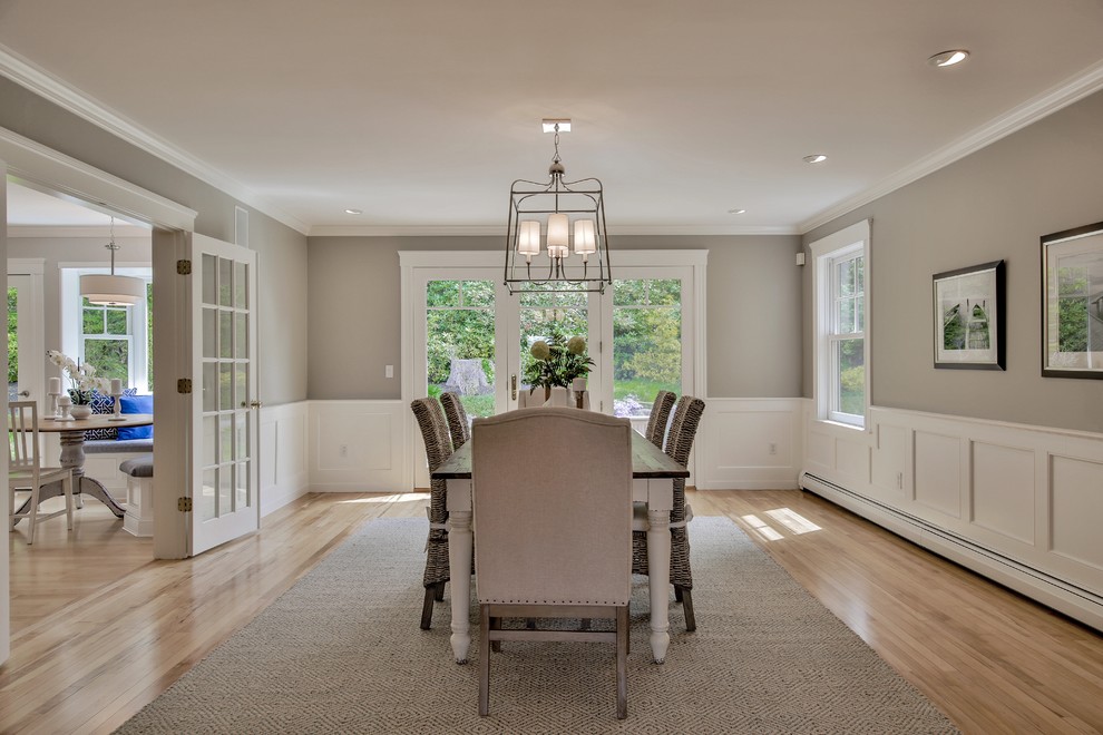 Inspiration for a large beach style separate dining room in Boston with grey walls, light hardwood floors and no fireplace.