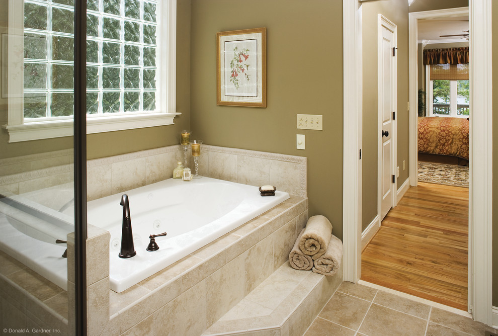Large arts and crafts master bathroom in Other with an alcove tub, a corner shower, beige tile and beige walls.