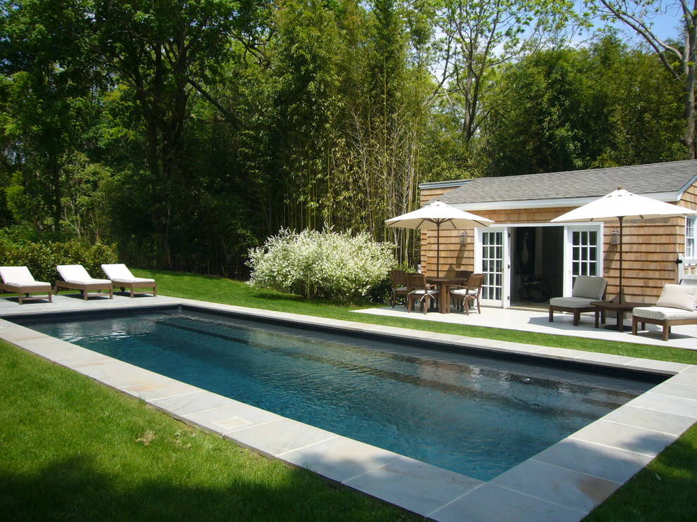 Inspiration for a beach style pool in New York with a pool house.