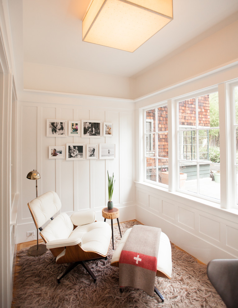 Small contemporary study room in San Francisco with white walls and light hardwood floors.