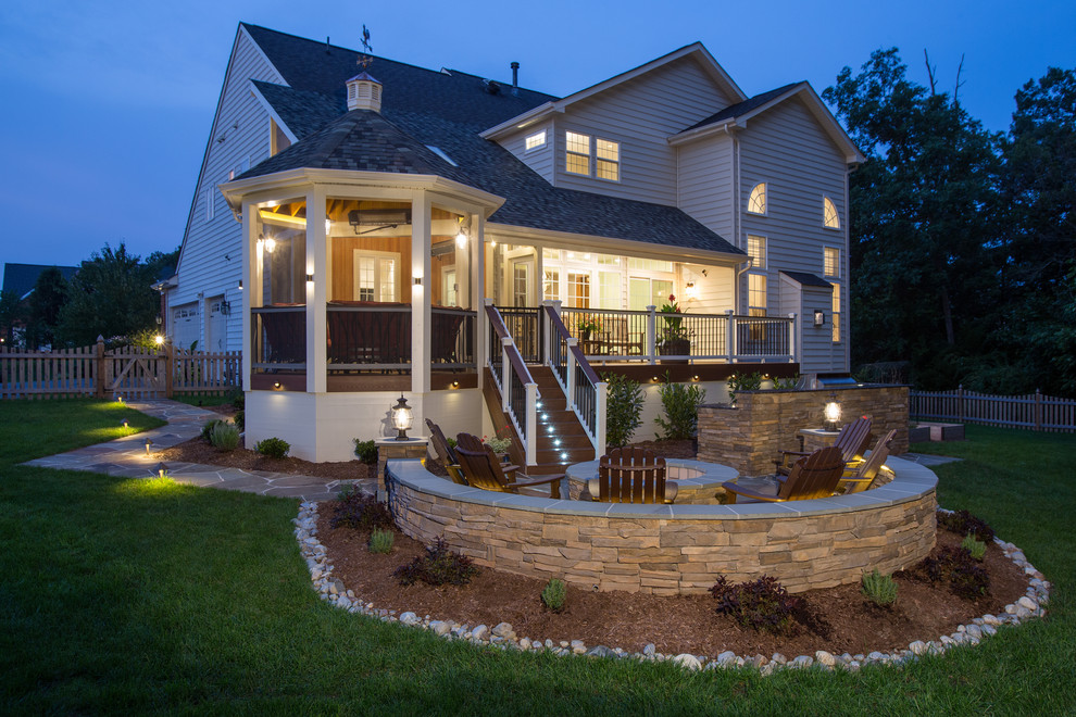 Inspiration for a large arts and crafts backyard deck in DC Metro with an outdoor kitchen and a roof extension.