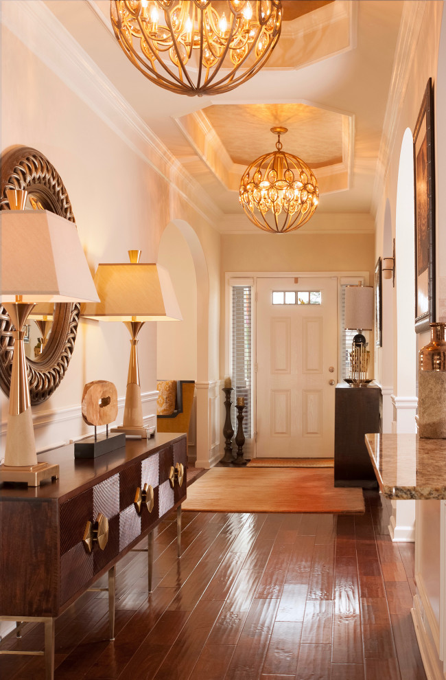 Design ideas for a mid-sized transitional entry hall in Miami with beige walls and a single front door.