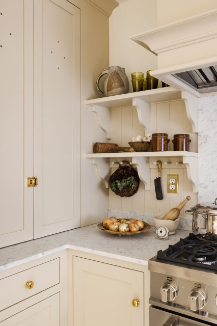 Beige Cabinets + Brass Hardware Bringing Charm To A Traditional Kitchen