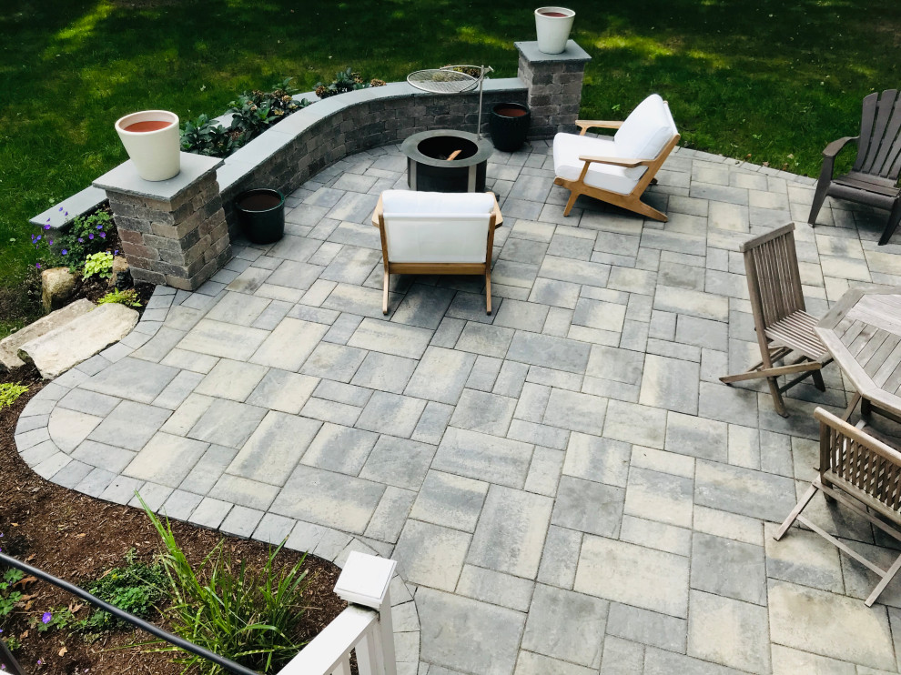 Design ideas for a small traditional back patio in Providence with concrete paving and no cover.