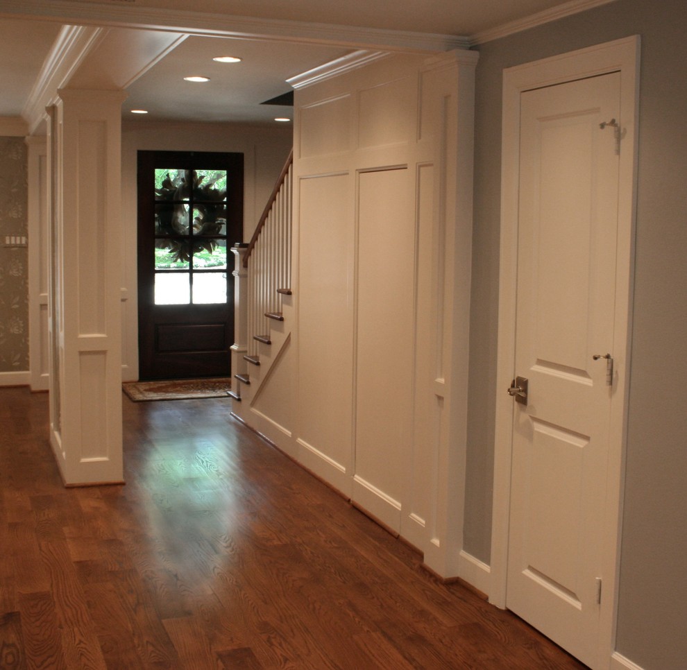 Mid-sized transitional medium tone wood floor and brown floor entry hall photo in Houston with gray walls and a brown front door