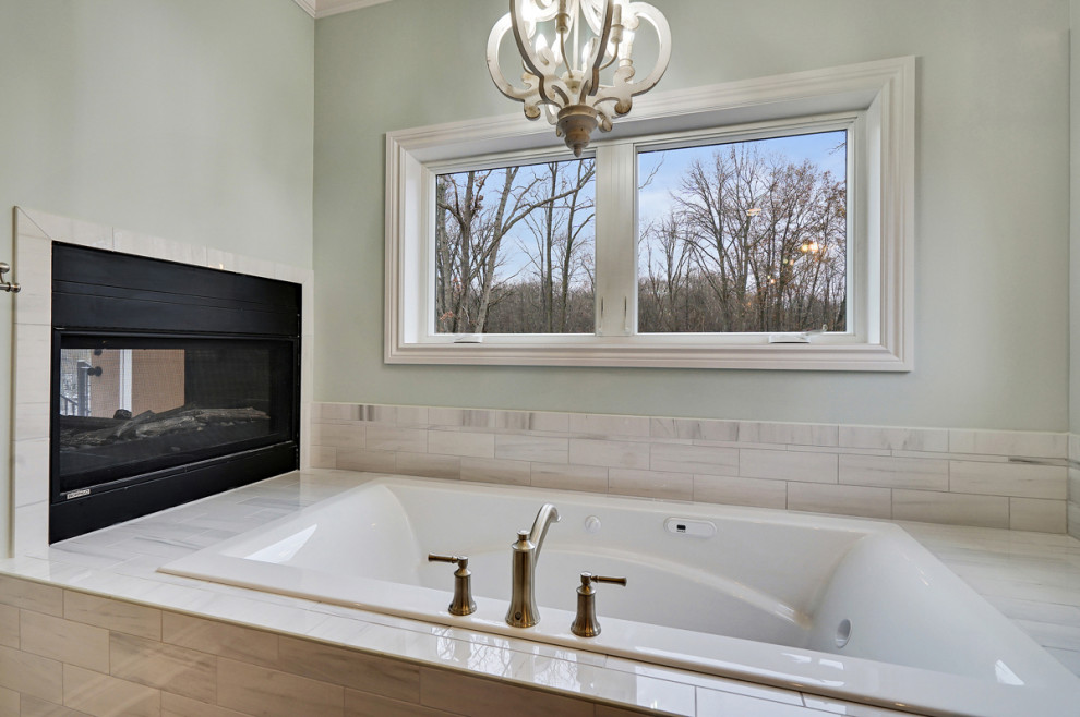 Photo of a large traditional master bathroom in Detroit with shaker cabinets, grey cabinets, a drop-in tub, an alcove shower, ceramic tile, grey walls, vinyl floors, an undermount sink, engineered quartz benchtops, grey floor, a hinged shower door, white benchtops, a shower seat, a double vanity and a built-in vanity.