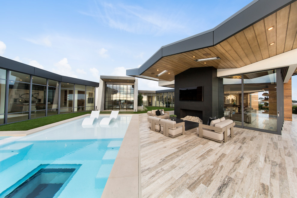 Inspiration for a contemporary rectangular pool in Orange County with a hot tub.