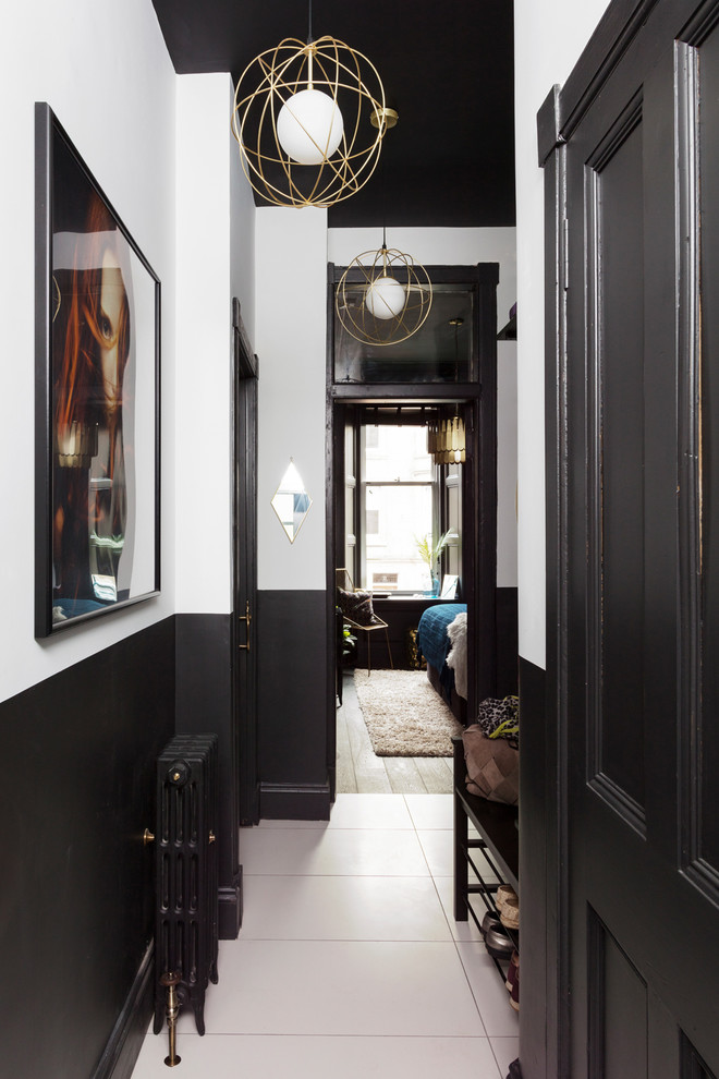 Design ideas for a small contemporary hallway in Other with multi-coloured walls, ceramic floors and white floor.