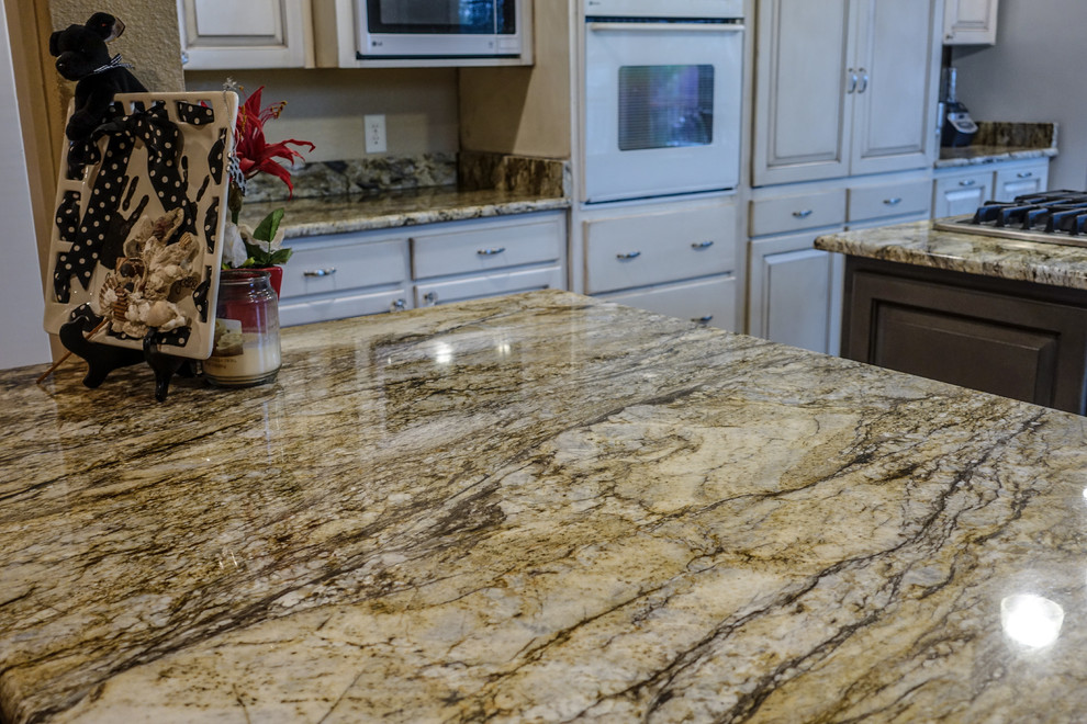 Inspiration for a rustic kitchen remodel in Austin with granite countertops