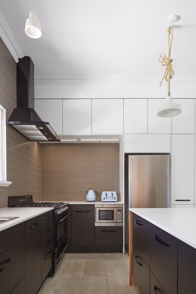 Design ideas for a contemporary kitchen in Perth with a drop-in sink, flat-panel cabinets, black cabinets, brown splashback, cement tile splashback, stainless steel appliances, with island, beige floor and white benchtop.