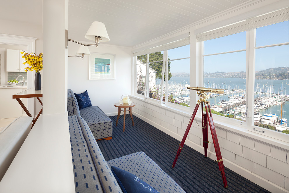 Inspiration for a beach style sunroom in Burlington with carpet, a standard ceiling and blue floor.