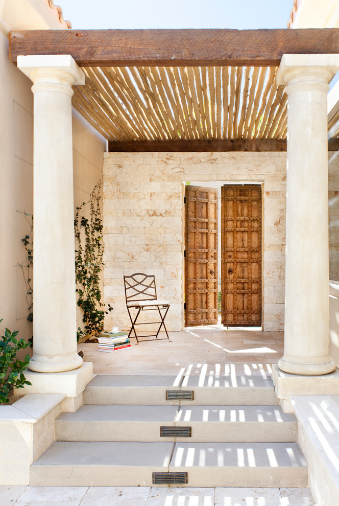 Design ideas for a mediterranean entryway in Los Angeles with a double front door.