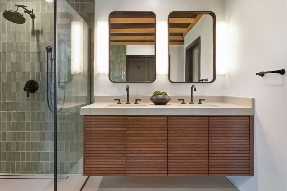 Large contemporary bathroom in Los Angeles with medium wood cabinets, a freestanding bath, a bidet, green tiles, porcelain tiles, white walls, porcelain flooring, an integrated sink, concrete worktops, grey floors, grey worktops, a wall niche, double sinks, a floating vanity unit and a wood ceiling.