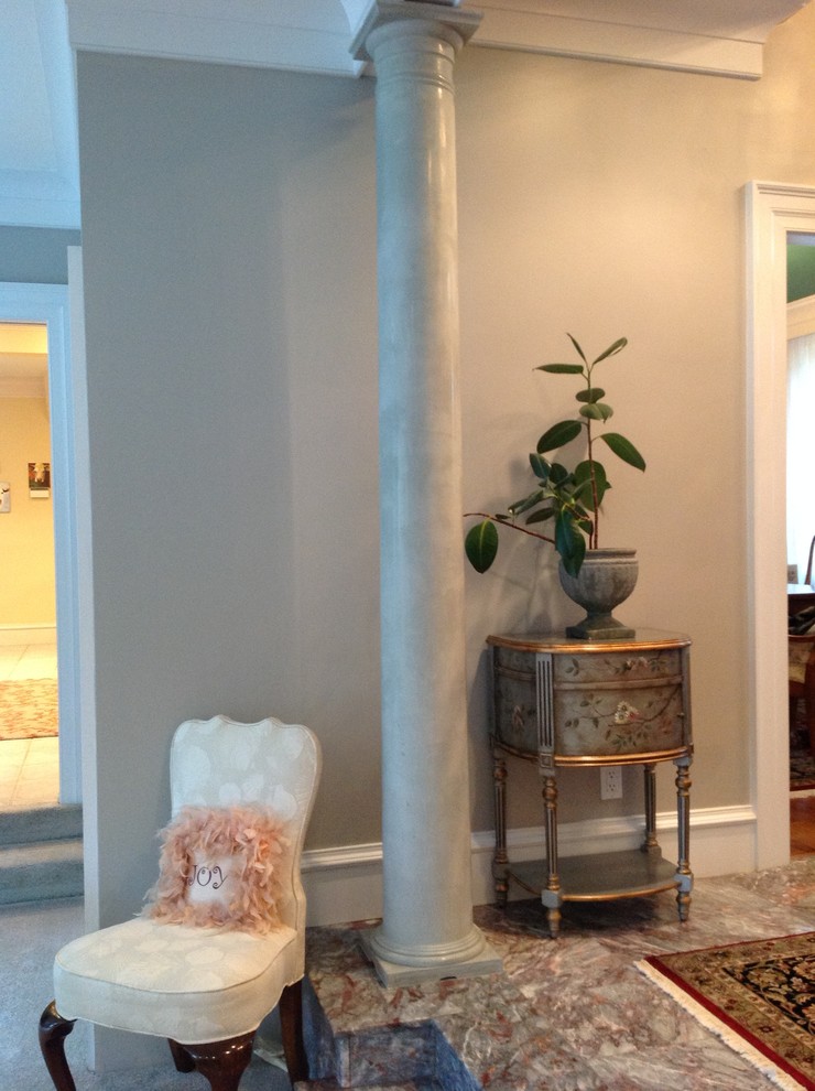 Entryway - mid-sized transitional marble floor entryway idea