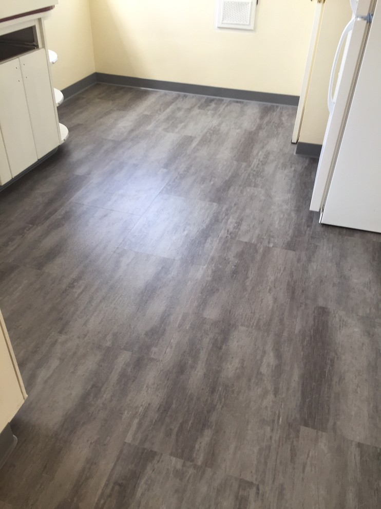Eat-in kitchen - small modern l-shaped vinyl floor eat-in kitchen idea with flat-panel cabinets, white cabinets, white appliances and no island
