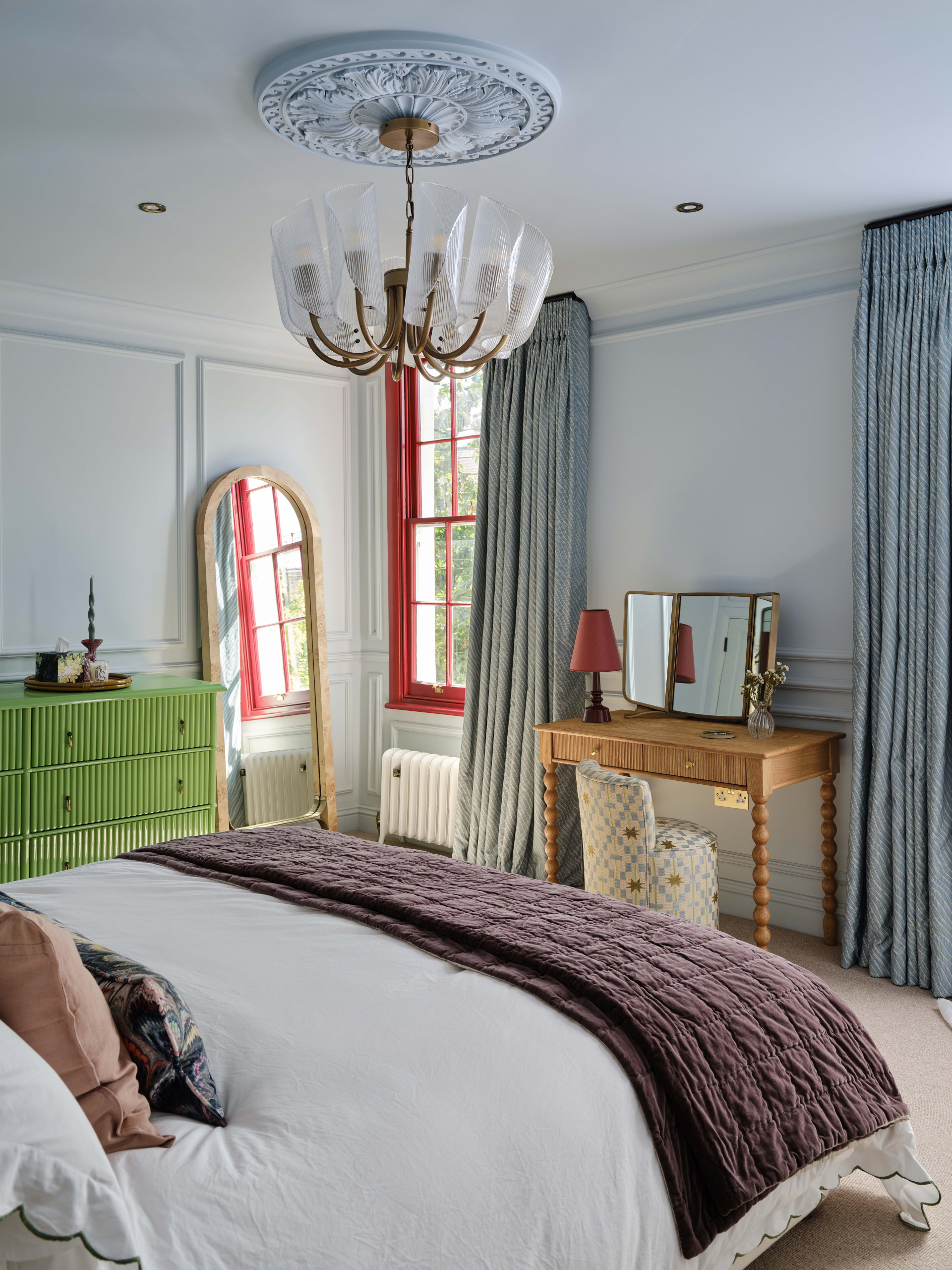 Example of a transitional bedroom design in London