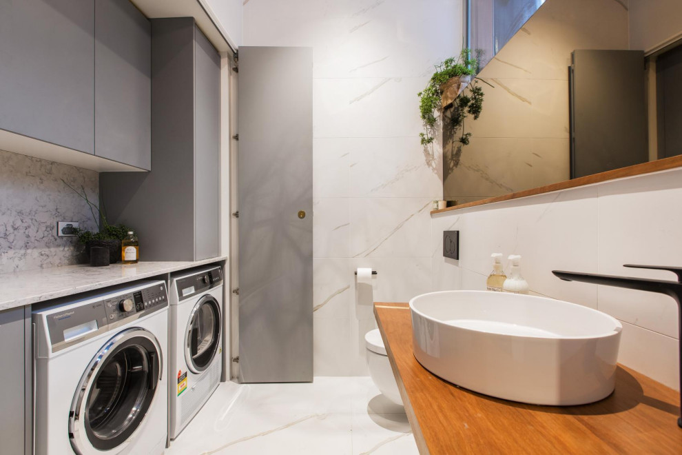This is an example of a contemporary laundry room in Melbourne.