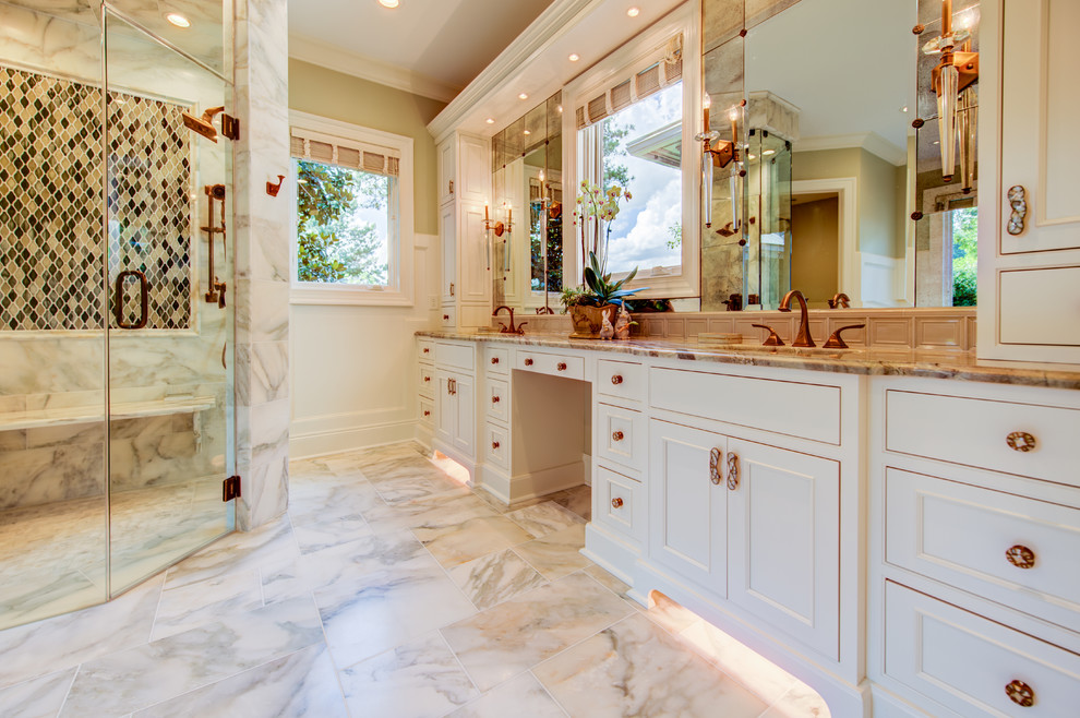 Design ideas for a mid-sized transitional master bathroom in Atlanta with recessed-panel cabinets, white cabinets, an undermount tub, an alcove shower, a two-piece toilet, multi-coloured tile, mosaic tile, beige walls, marble floors, an undermount sink, marble benchtops, white floor and a hinged shower door.