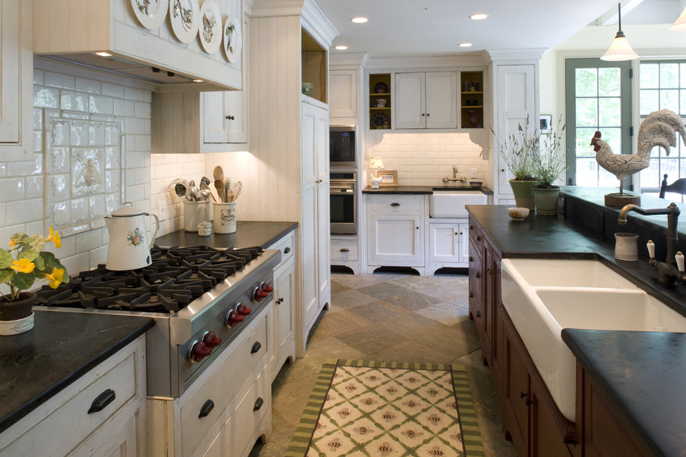 Design ideas for a traditional kitchen in Philadelphia with beaded inset cabinets, subway tile splashback, a double-bowl sink, soapstone benchtops, white cabinets and white splashback.