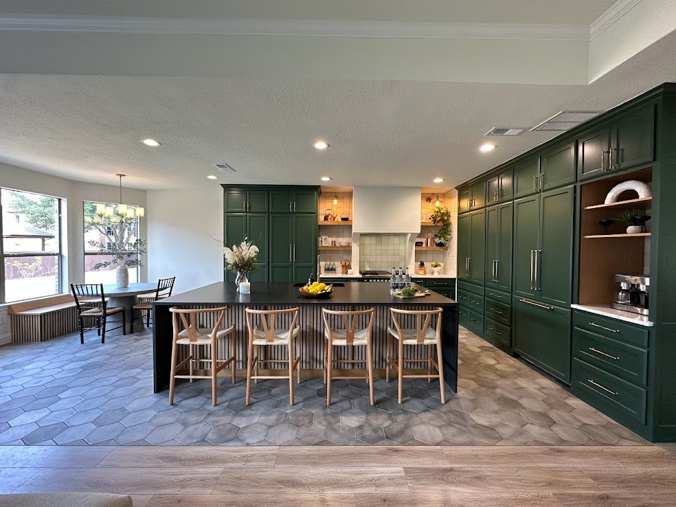 Design ideas for a large transitional l-shaped kitchen pantry in Dallas with a single-bowl sink, shaker cabinets, green cabinets, quartzite benchtops, white splashback, ceramic splashback, panelled appliances, porcelain floors, with island, grey floor and black benchtop.