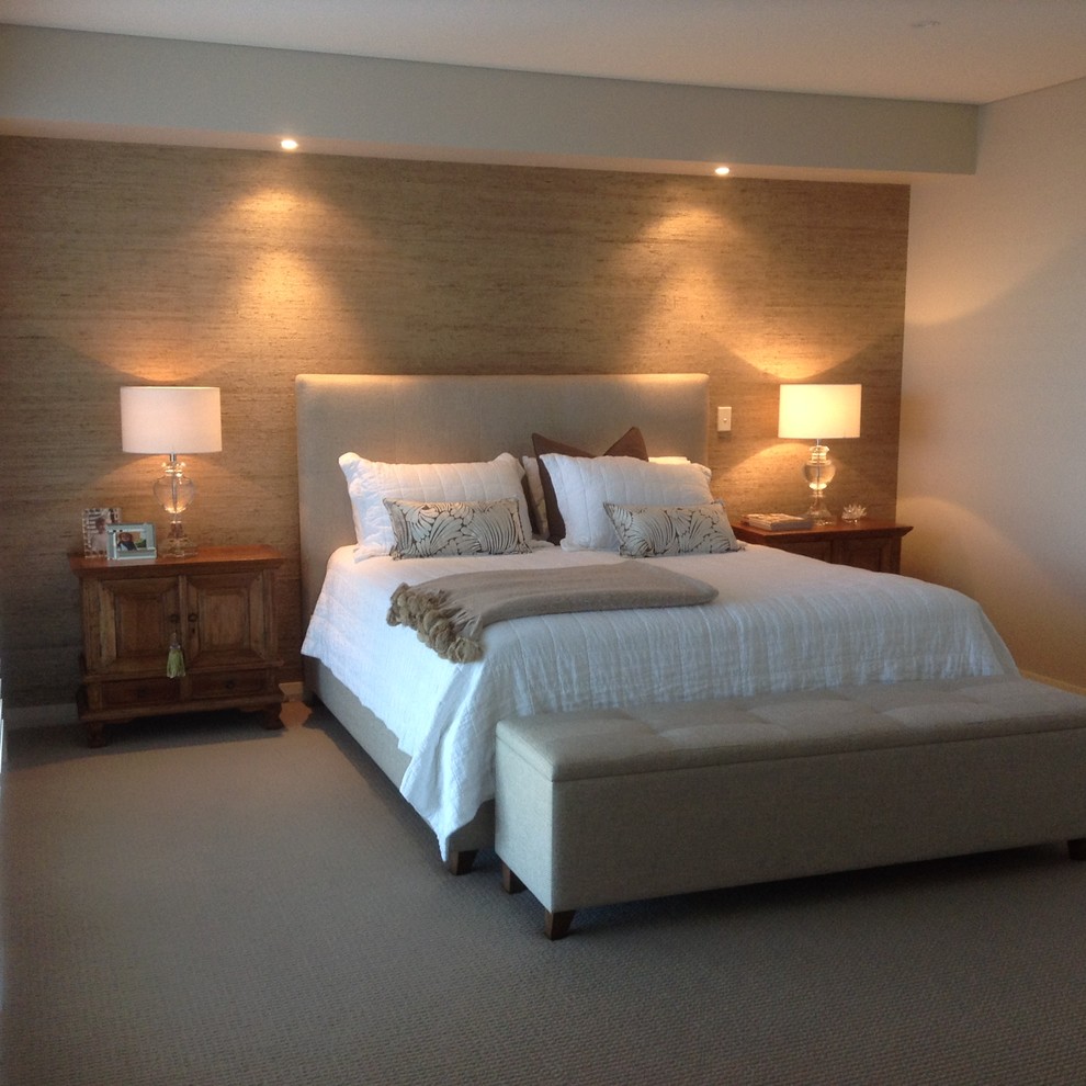 This is an example of a contemporary master bedroom in Perth with carpet.