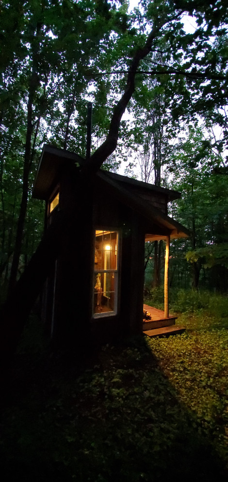 Home design - small rustic home design idea in New York