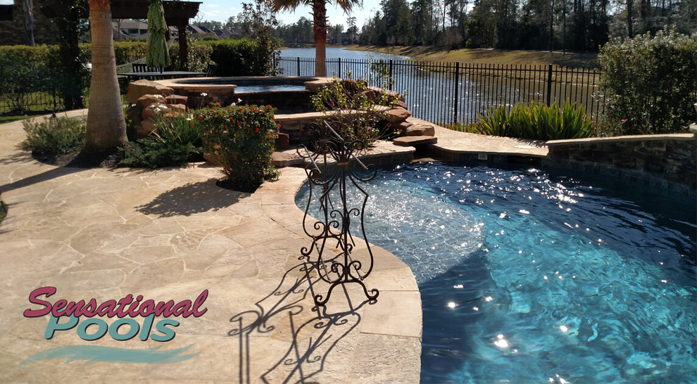 Large tuscan backyard concrete and custom-shaped natural pool fountain photo