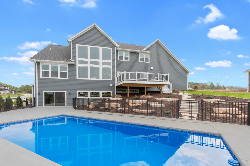 Inspiration for a large transitional backyard concrete and rectangular lap pool landscaping remodel