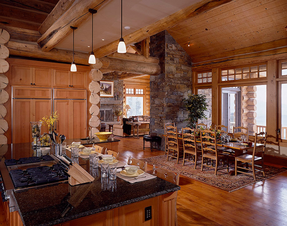 Eat-in kitchen - medium tone wood floor eat-in kitchen idea with medium tone wood cabinets, granite countertops, paneled appliances and an island