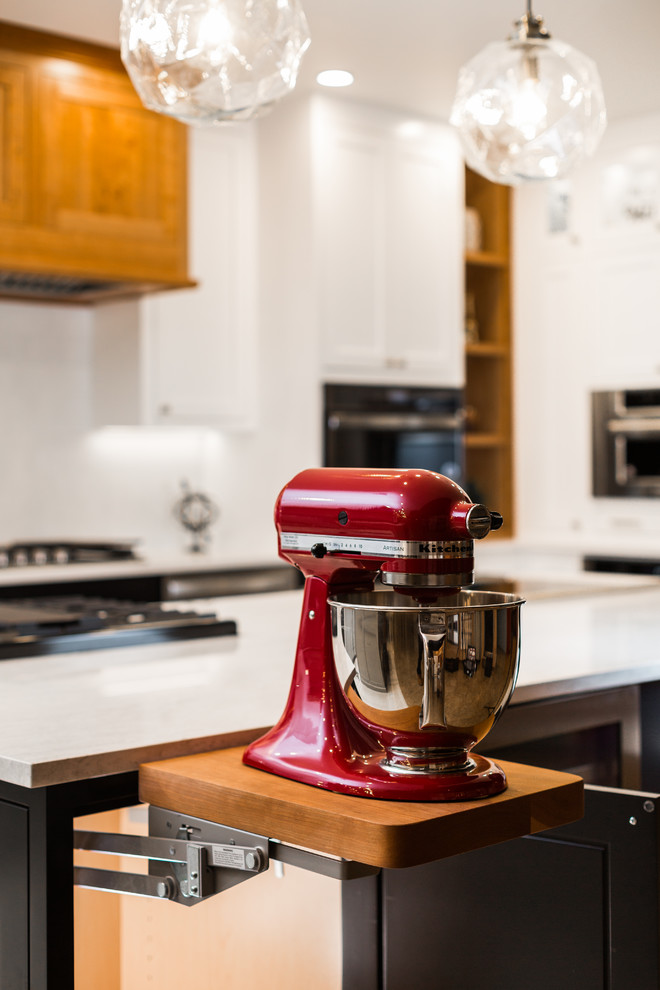 Enclosed kitchen - mid-sized transitional l-shaped porcelain tile and beige floor enclosed kitchen idea in Albuquerque with shaker cabinets, white cabinets, quartz countertops, white backsplash, mosaic tile backsplash, stainless steel appliances, an island and white countertops