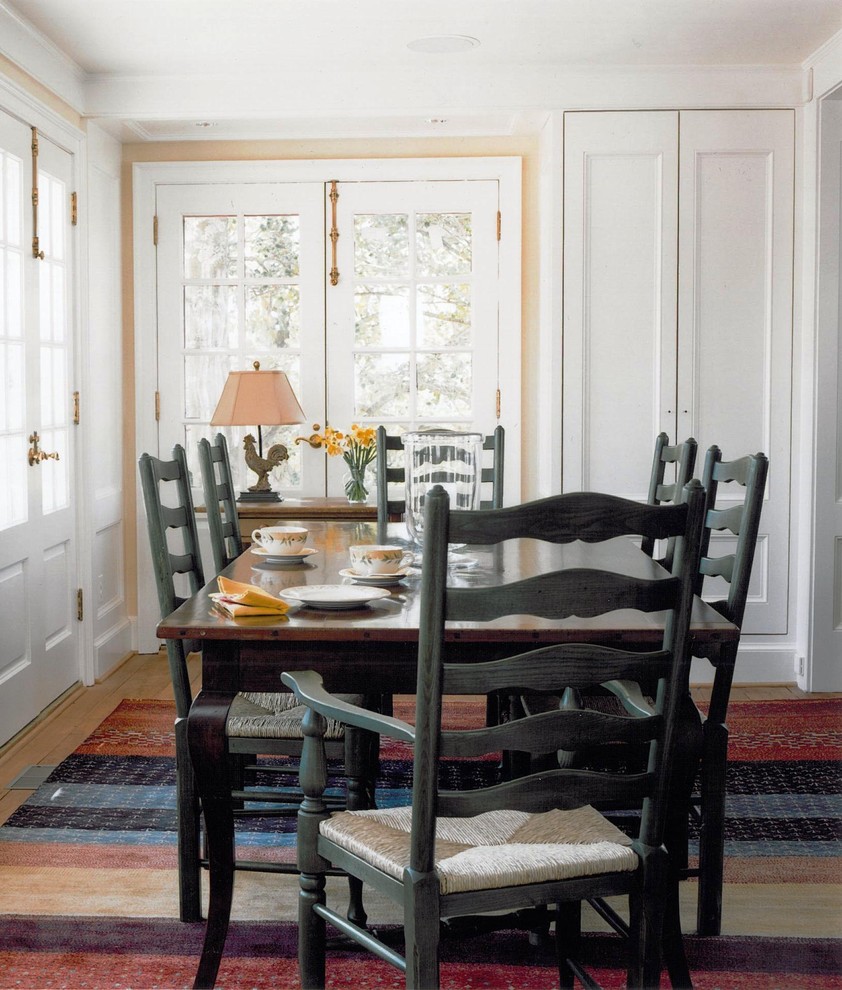 Country dining room in DC Metro with beige walls and medium hardwood floors.