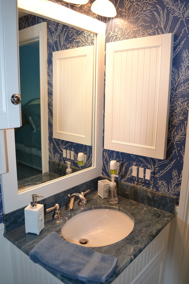Small tropical master bathroom in Miami with an undermount sink, shaker cabinets, white cabinets, granite benchtops, a freestanding tub, white tile, porcelain tile, blue walls and porcelain floors.
