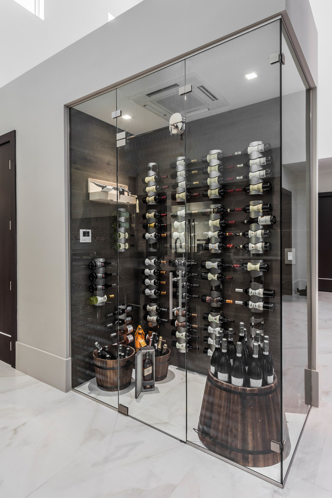Design ideas for a contemporary wine cellar in Miami with storage racks, white floor and marble floors.